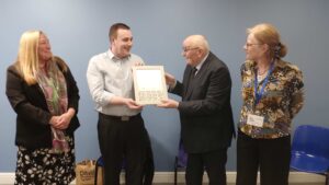 Cllr Bell presenting Gold Award to Pelton's Chair Danny Wood